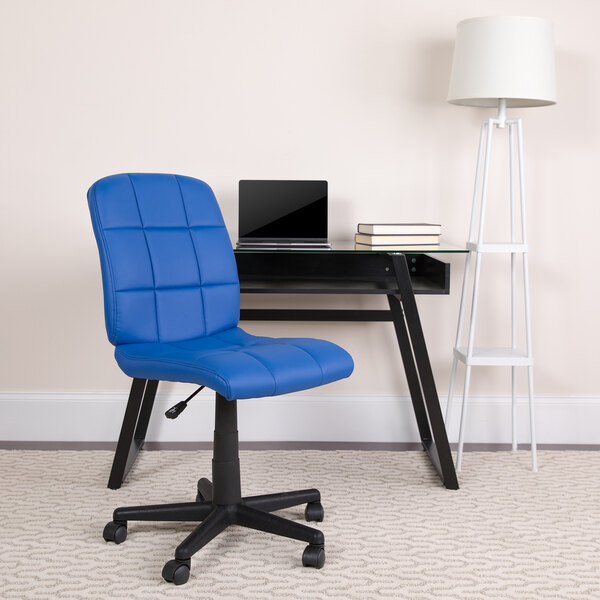 A blue Flash Furniture mid-back office chair with wheels next to a desk.