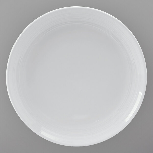 A Tuxton Pacifica bright white china plate with an embossed rim.