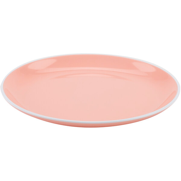 A pink GET Settlement Oasis melamine plate with a white rim.