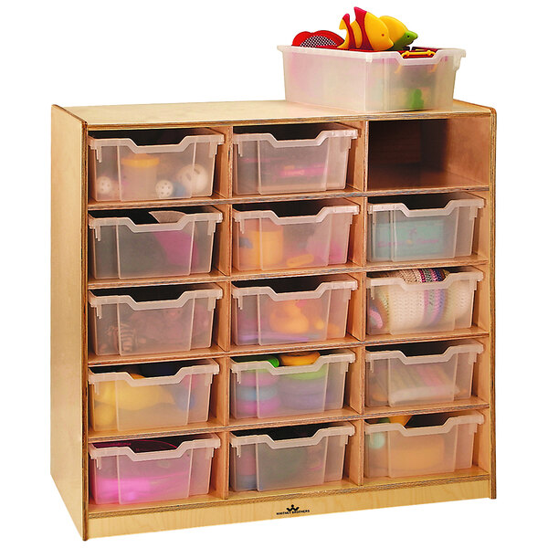 A Whitney Brothers wooden storage cabinet with plastic bins on shelves.