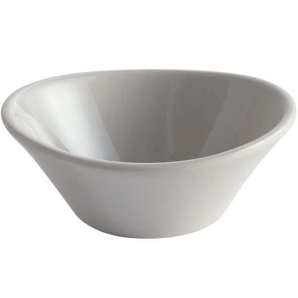 A white bowl with a small white bowl on top.
