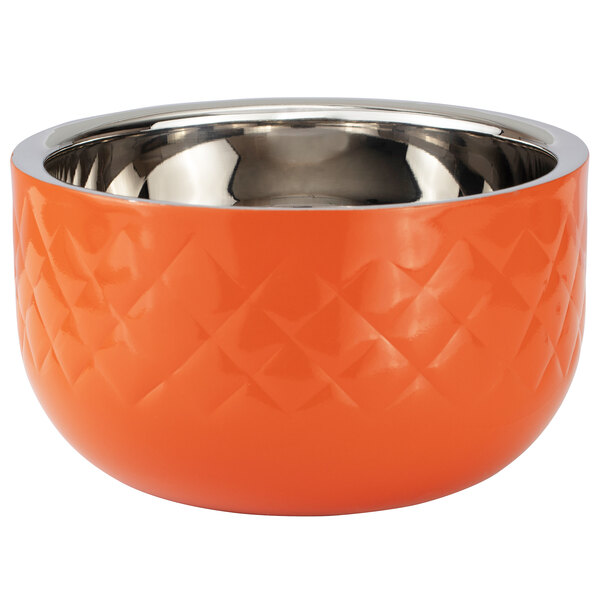 An orange bowl with a silver rim.