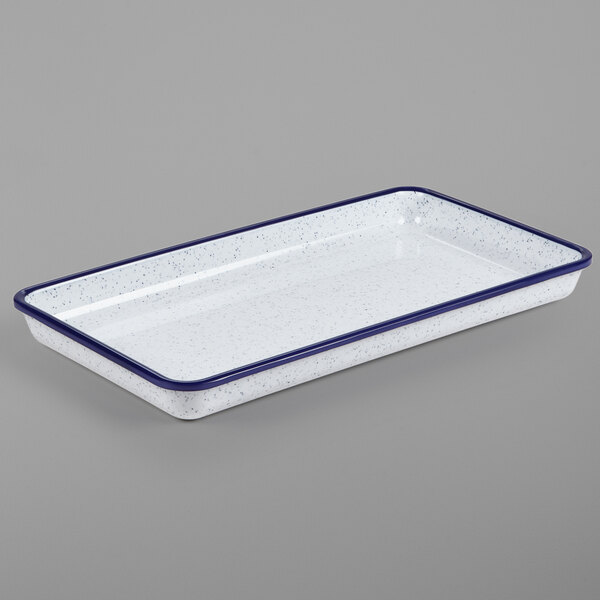 A white rectangular tray with blue speckles and trim.