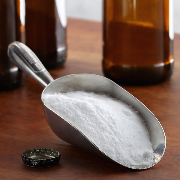 A spoon filled with white powder.