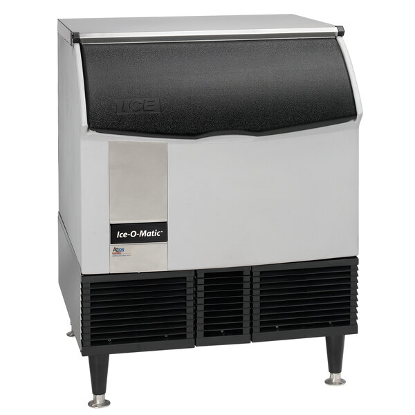 An Ice-O-Matic undercounter ice machine with a white and black lid and silver trim.