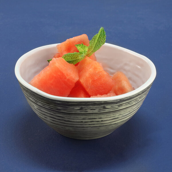 An Elite Global Solutions Doheny melamine bowl with a beach design filled with watermelon slices.