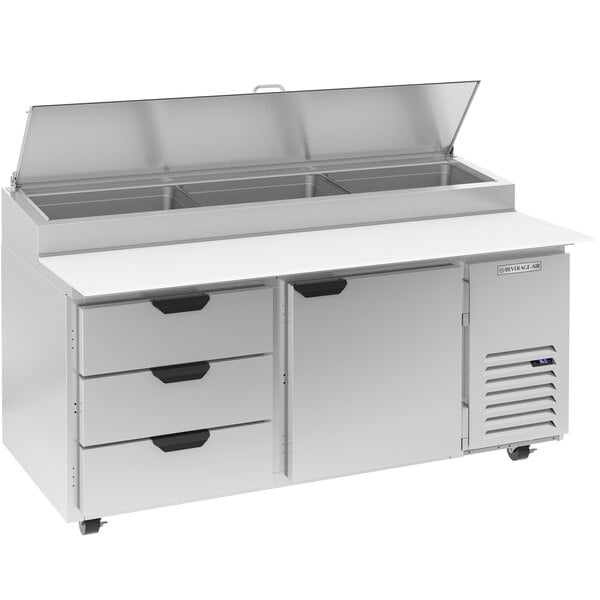 A stainless steel Beverage-Air pizza prep table with three drawers.