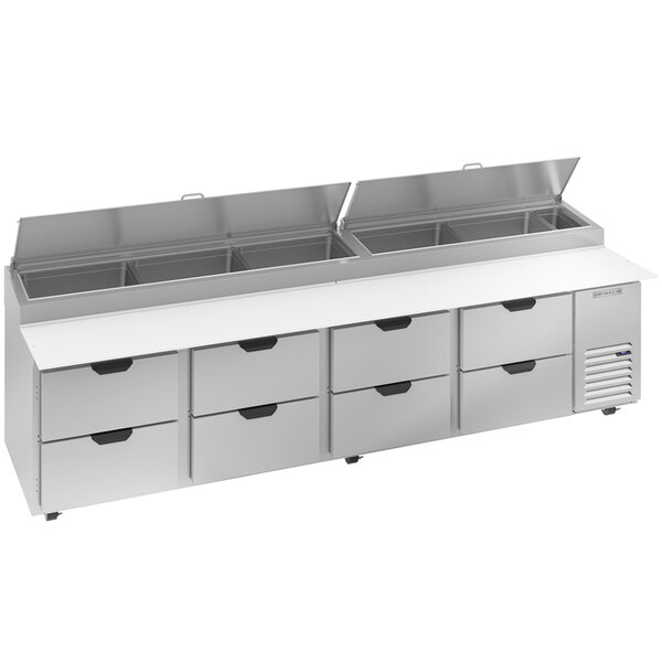 A silver Beverage-Air refrigerated pizza prep table with eight drawers.