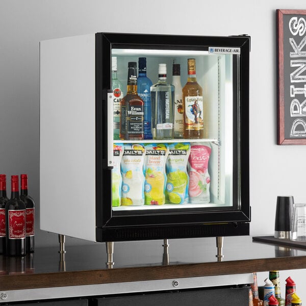 A Beverage-Air countertop display freezer with a glass door filled with bottles of beverages.
