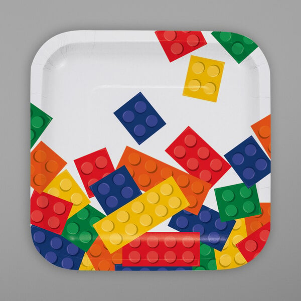 A Creative Converting paper plate with colorful lego blocks on it.