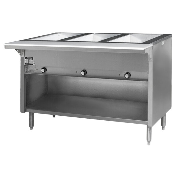 A stainless steel Eagle Group hot food table with three open wells on a counter.