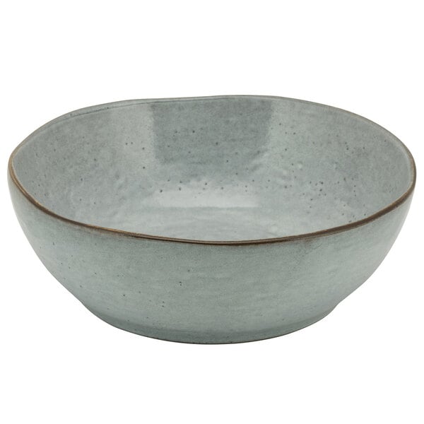 A blue porcelain bowl with a brown rim.