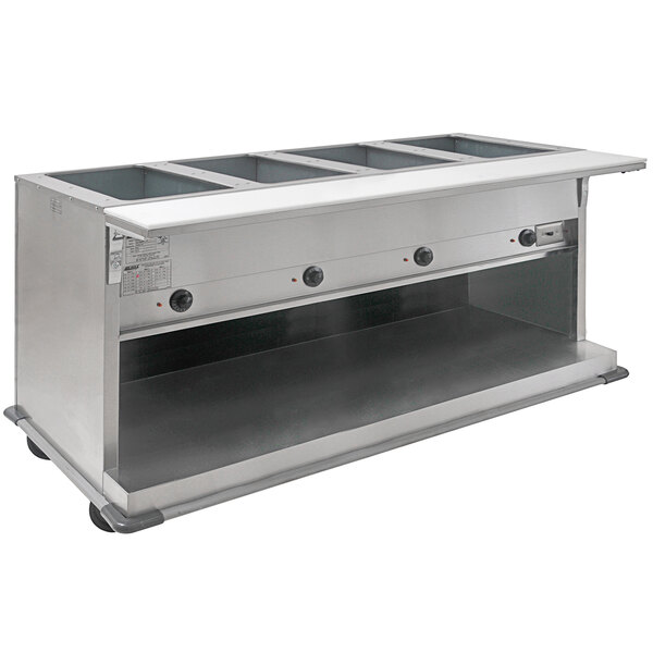 An Eagle Group stainless steel electric hot food table with an open front holding four trays.