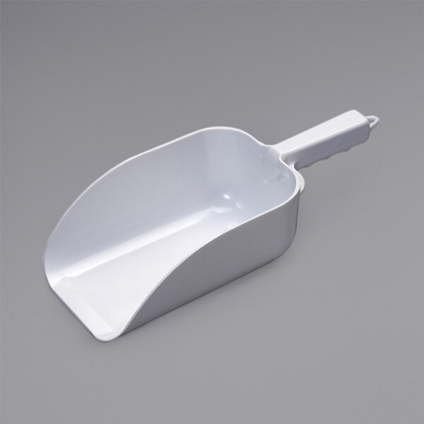 An Ice-O-Matic white plastic ice scoop with a handle.