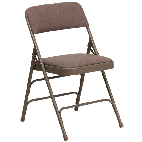 A beige metal folding chair with a padded seat.
