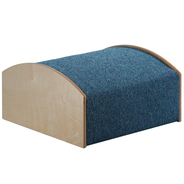 A blue cushioned wooden hill.