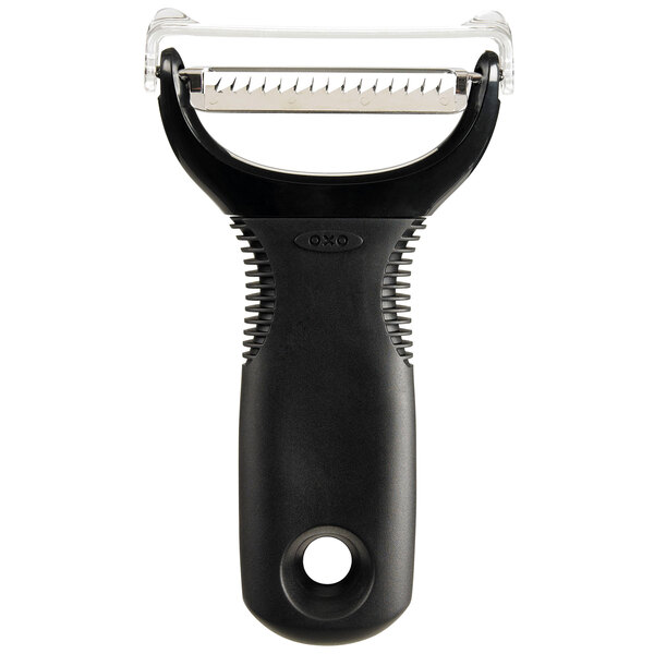 An OXO black and white plastic vegetable peeler with a round handle.