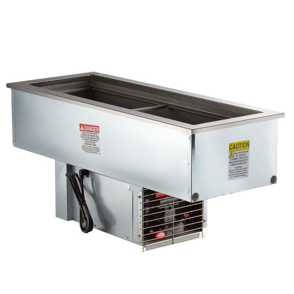 A Delfield narrow stainless steel drop-in refrigerated cold food well with two pans on a counter.