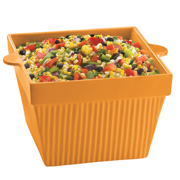 A Tablecraft orange square condiment bowl filled with food.