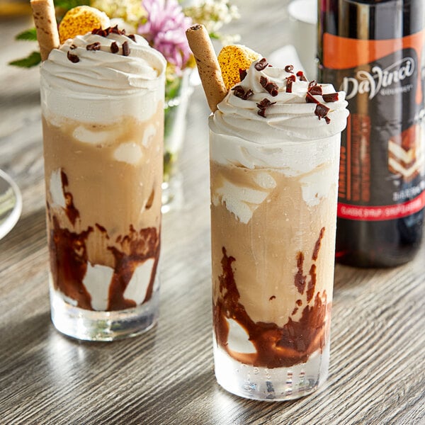 Two glasses of ice cream with DaVinci Gourmet Classic Tiramisu syrup and chocolate toppings.