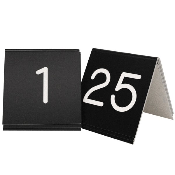A black Cal-Mil table number tent with the number twenty in white.