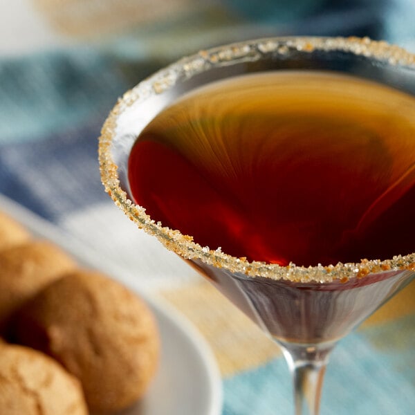 A glass of DaVinci Gourmet Classic Gingerbread flavoring syrup with a brown sugar rim.