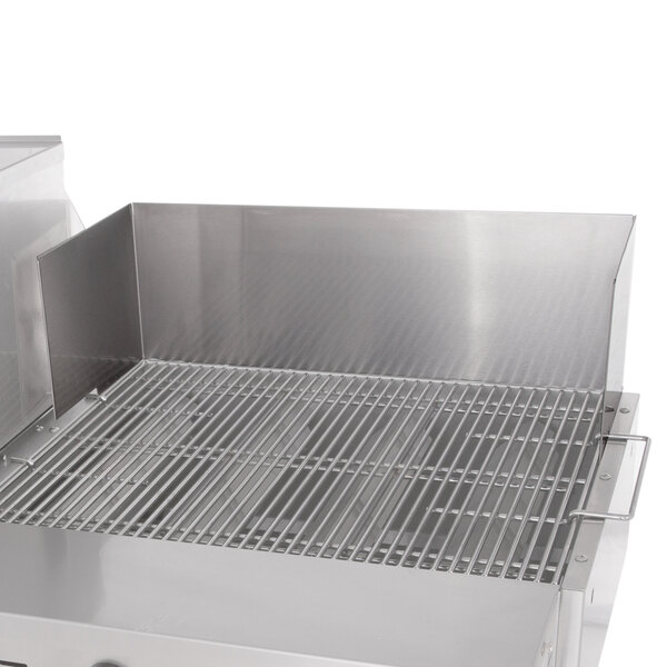 A stainless steel Bakers Pride outdoor charbroiler with grate.