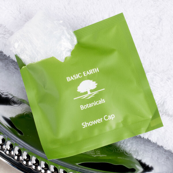 A green Basic Earth Botanicals package on a white background.