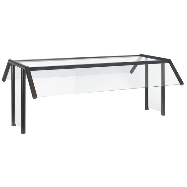 A Vollrath traditional style buffet sneeze guard with a black metal frame over a table.