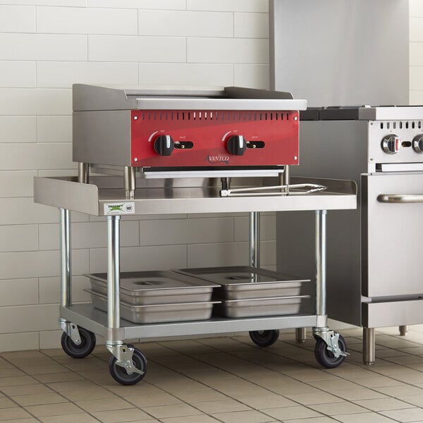 A Regency stainless steel equipment stand with galvanized legs on a kitchen counter.