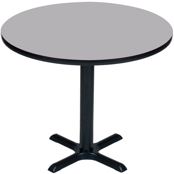 A Correll round table with a black base and a grey granite finish.
