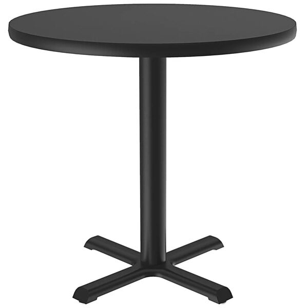 A Correll black round table with a metal base.