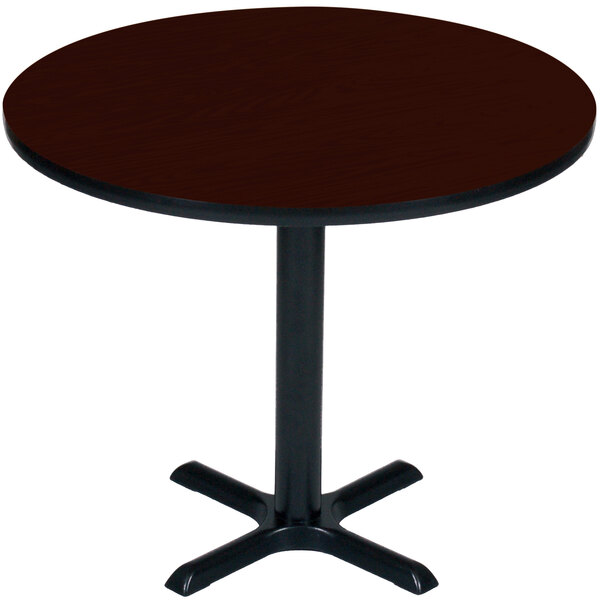 A Correll round table with a mahogany top and black base.