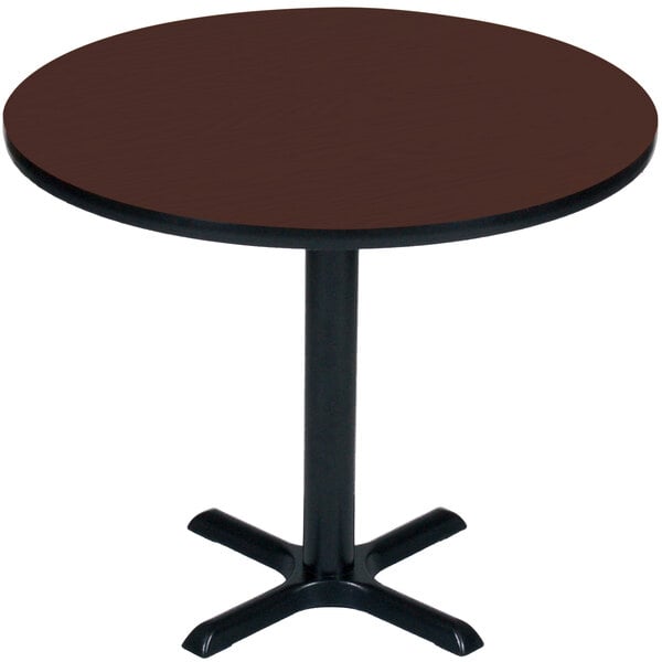 A Correll round table with a cherry finish top and black base.
