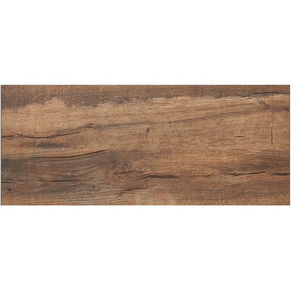A BFM Seating Relic Knotty Pine rectangular table top with a brown wood surface and cracks.