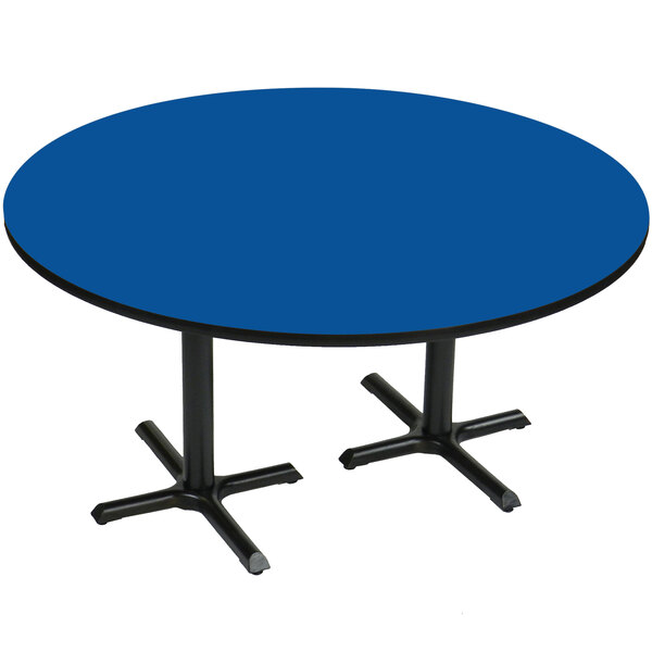 A blue Correll round table with two black metal legs.