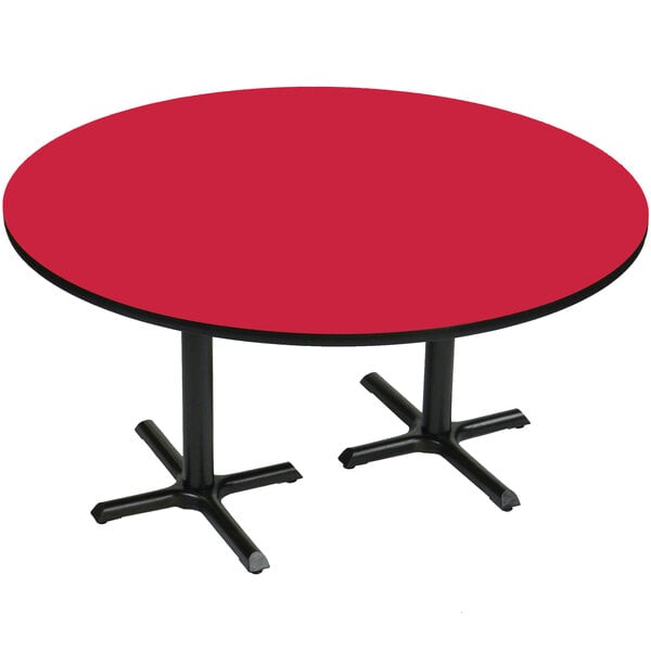 A red table with black legs and two cross bases.