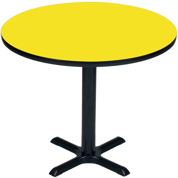 A Correll yellow table with a black base and a round top.