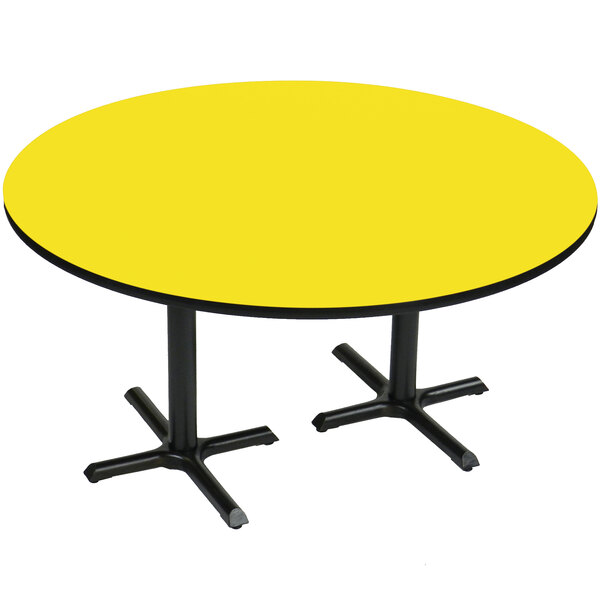 A yellow table with black legs.