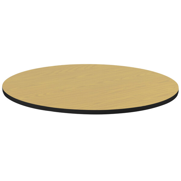 A Correll round wood table top with black edge.