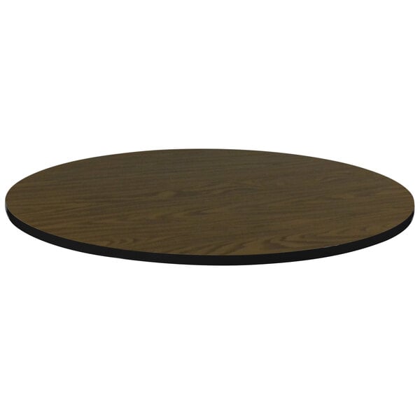 A brown circular table top with a black edge.