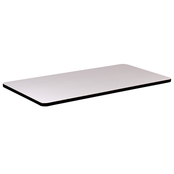 A white rectangular table top with black edges.