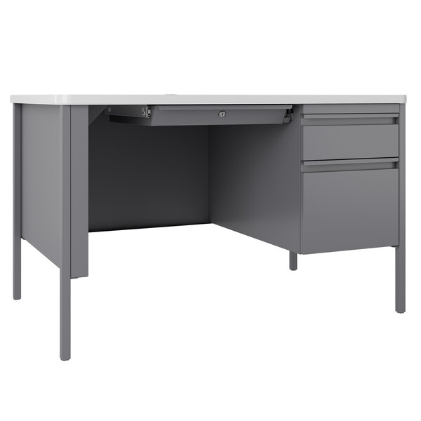A gray Hirsh Industries single pedestal desk with white drawers and top.