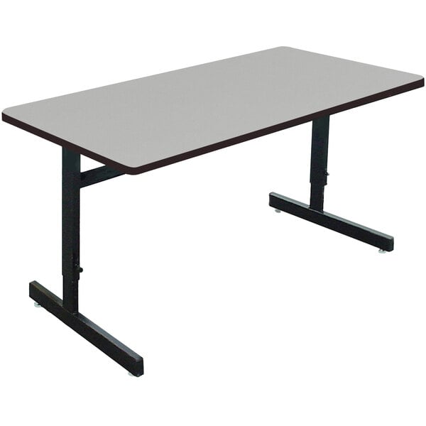 A rectangular gray granite computer table with black legs.