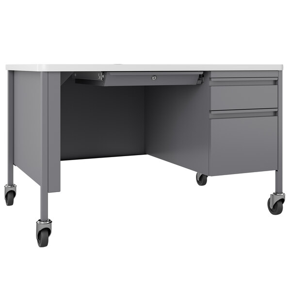 A platinum grey teacher's desk with a single drawer.
