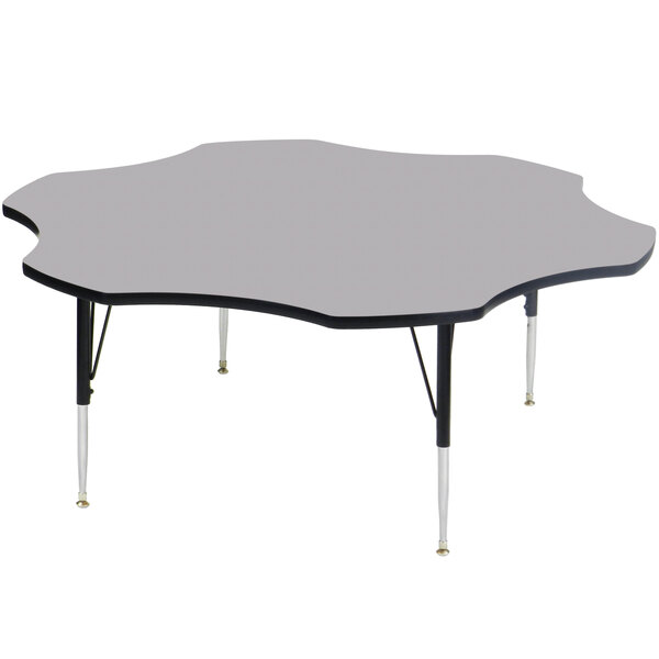 A Correll activity table with a gray granite surface and black legs.