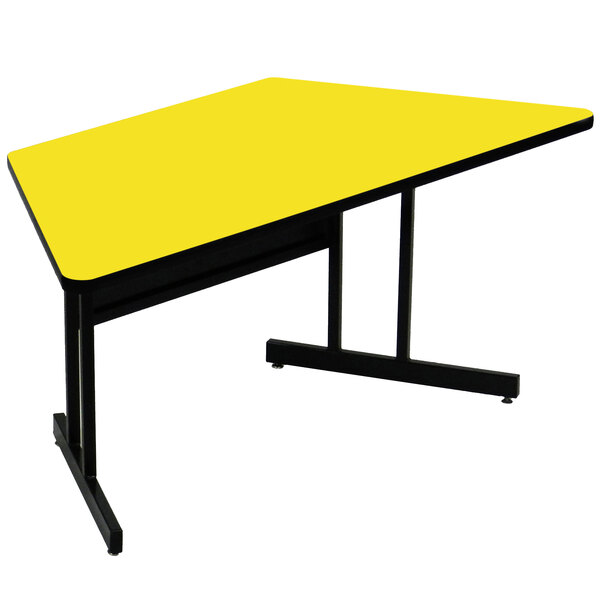 A yellow trapezoid table with black legs.