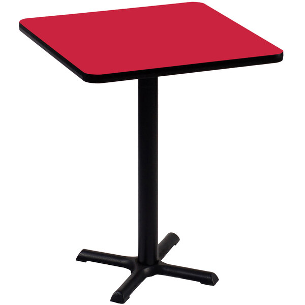 A red square Correll bar height table with a black base.