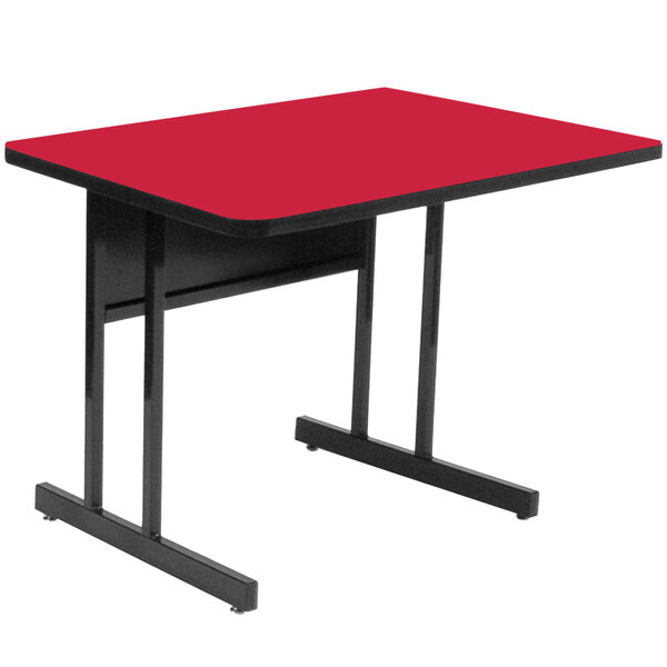 A red rectangular Correll computer and training table with black edges.