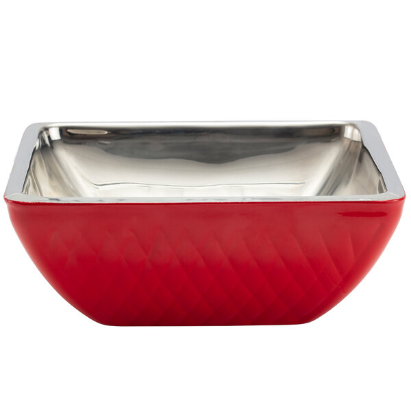 A red and silver Bon Chef square bowl on a counter.